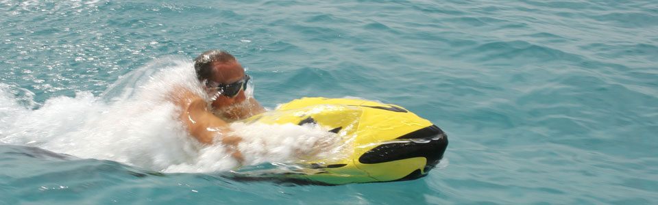 Man coming out of the water at high speed with seabob